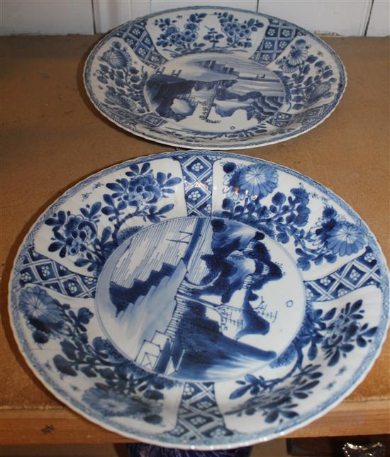 A pair of Chinese blue and white fluted dishes, Kangxi period, 27cm diam., one repaired